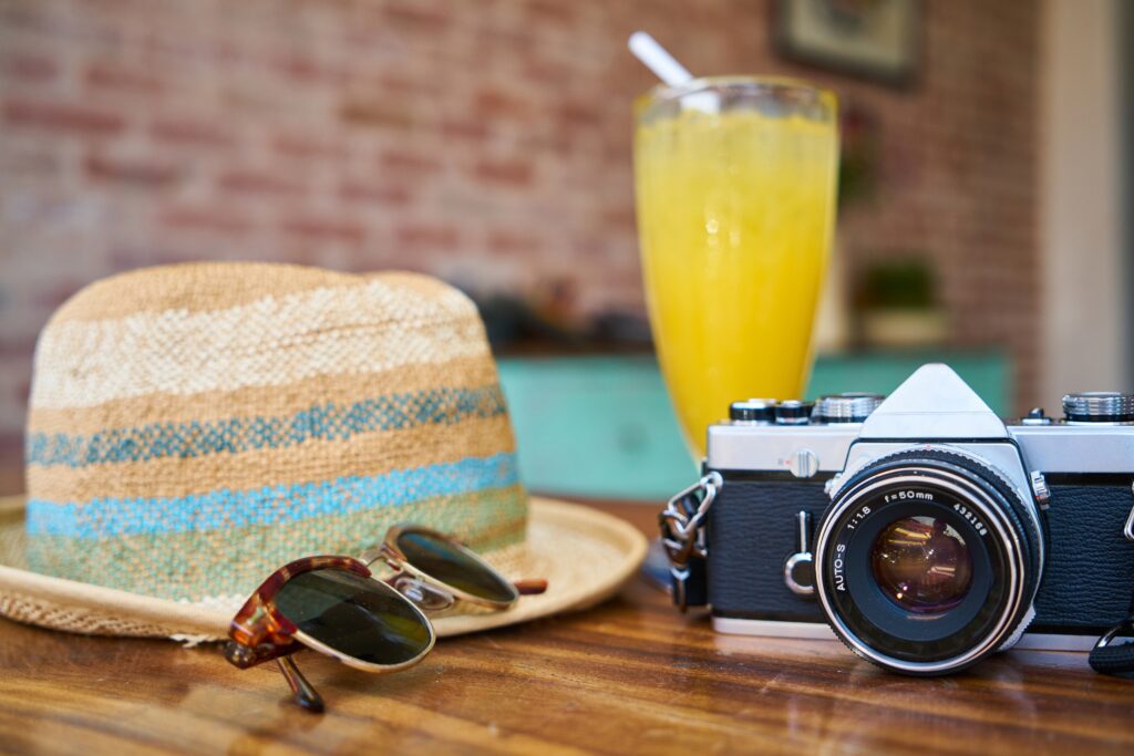 hat-glasses-camera-holiday-travel-tips