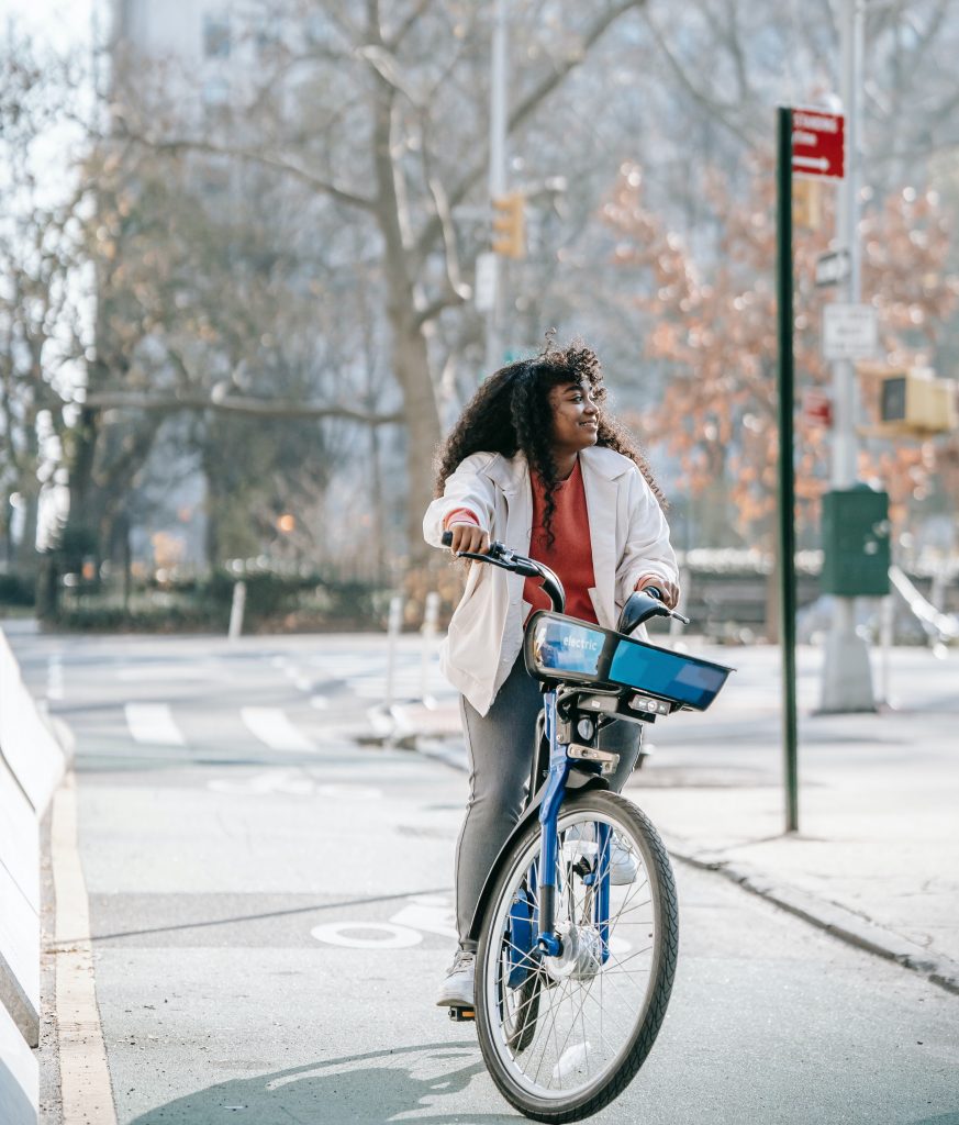 woman-cycling-smile-city