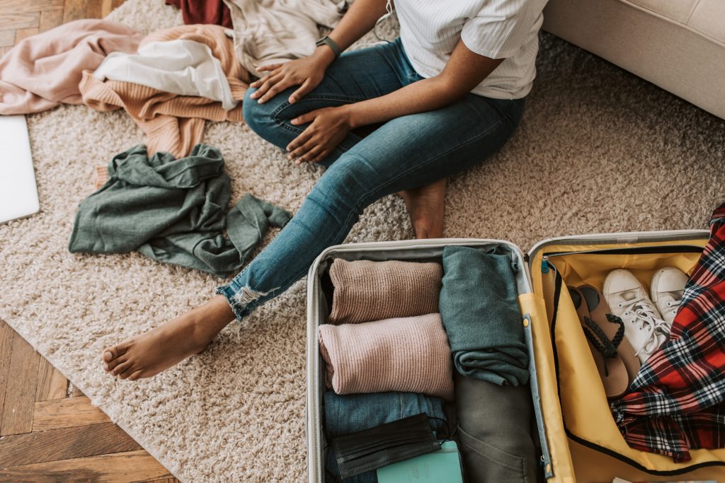 long-distance expat relationships_woman packing suitcase_expat nest