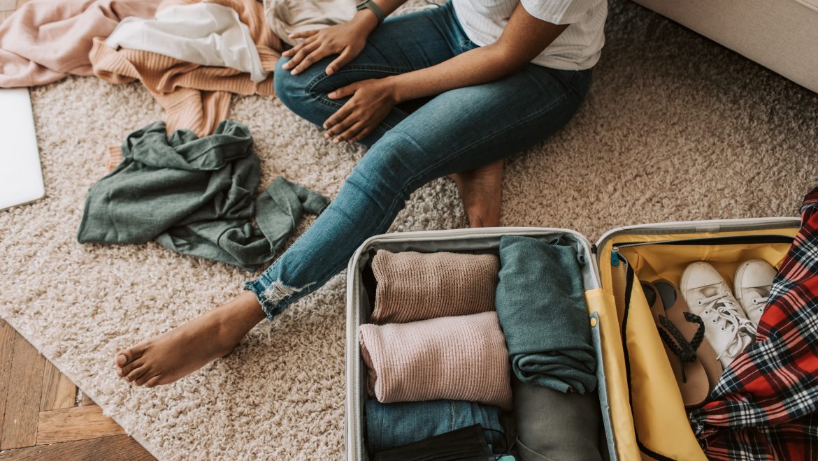 long-distance expat relationships_woman packing suitcase_expat nest
