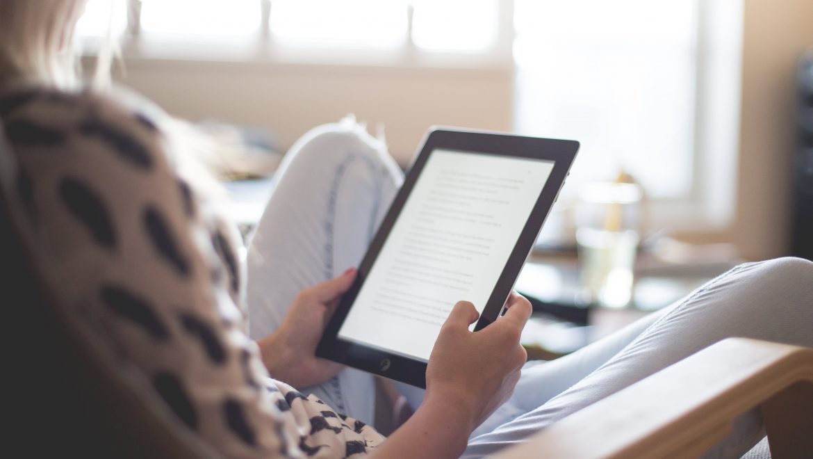 woman-reading-tablet-expat-nest-10-best-articles